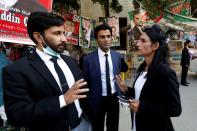 Nisha Rao, 28, a transgender woman who became country's first practicing lawyer, talks with her colleagues at district City Court in Karachi,