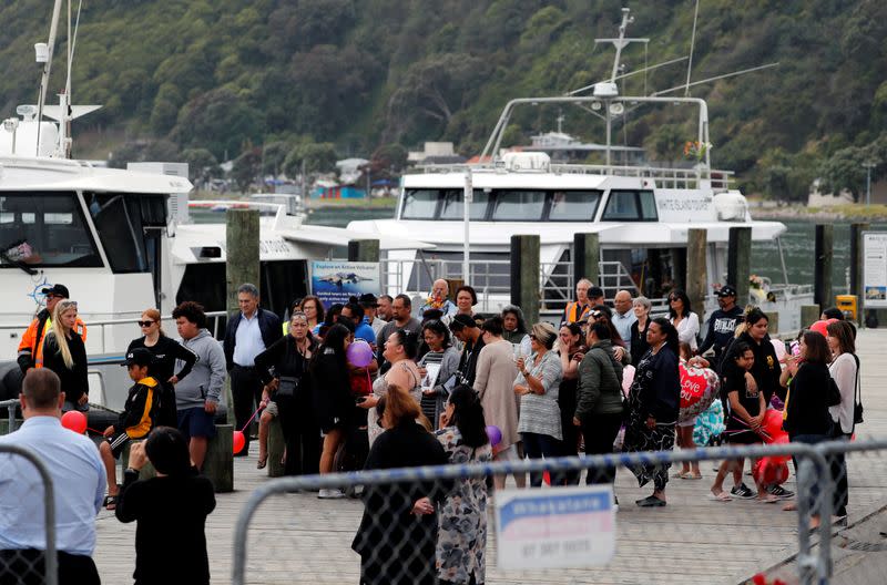 Relatives wait for rescue mission, following the White Island volcano eruption in Whakatane