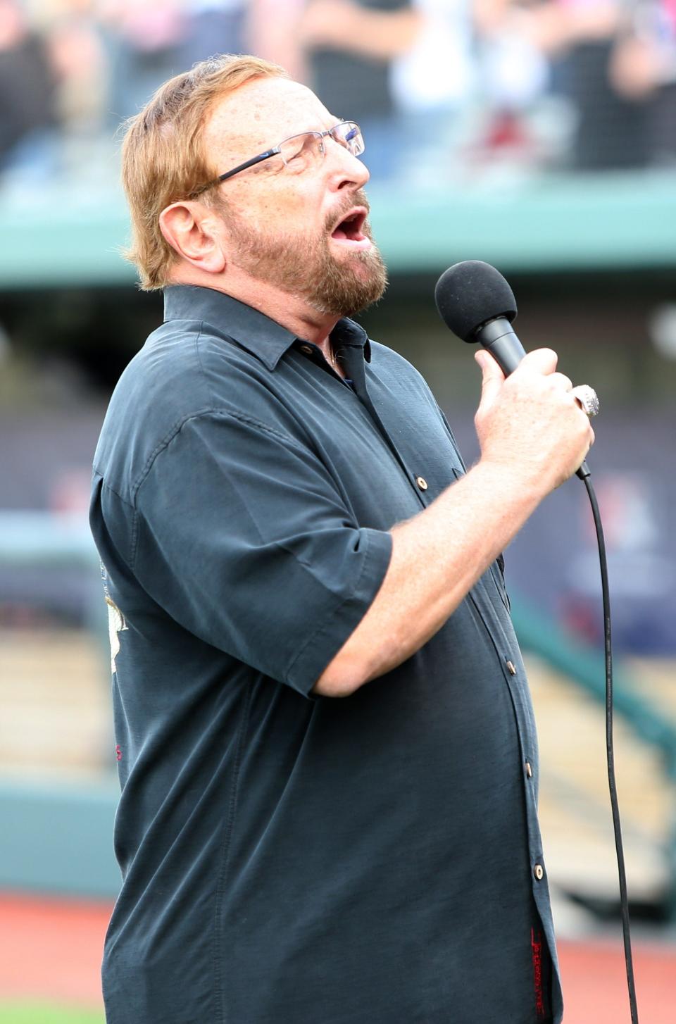 Wayne Messmer sings the National Anthem Tuesday, April 11, 2023, at Four Winds Field for the 2023 season home opening baseball game against Beloit.