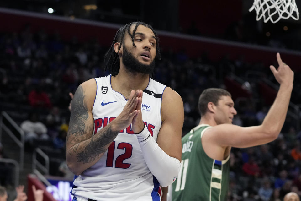 Detroit Pistons forward Isaiah Livers (12) reacts after a play during the first half of an NBA basketball game against the Milwaukee Bucks, Monday, March 27, 2023, in Detroit. (AP Photo/Carlos Osorio)