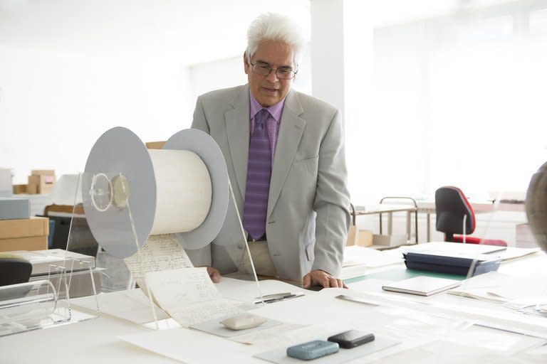 File photo released by manipula.co.nz shows author Ray Waru inspecting files at New Zealand's national archives in Wellington on December 7, 2012, following the release of his book about rare historical gems buried in the archives, including a bizarre WWII plan to create a "tsunami bomb" and military X-Files detailing supposed UFO sightings