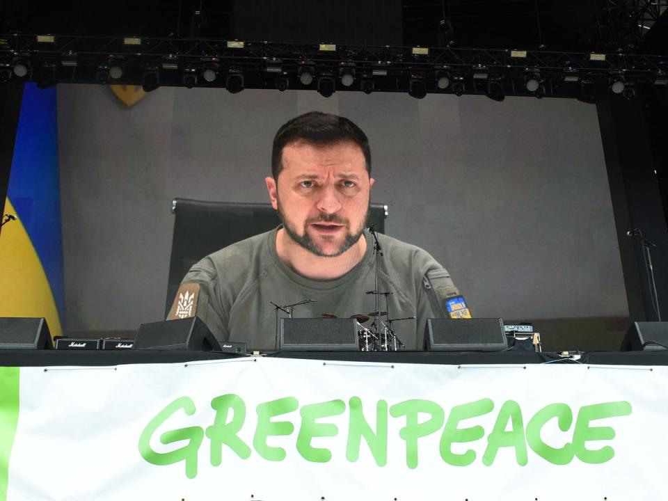 Ukraine’s President Volodymyr Zelensky addresses festivalgoers via a video link during Glastonbury festival (AFP via Getty Images)