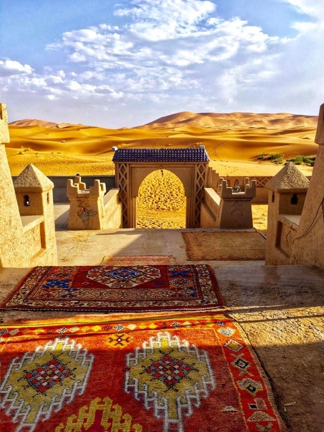 the edge of a hotel overlooking dunes of sand in Morocco