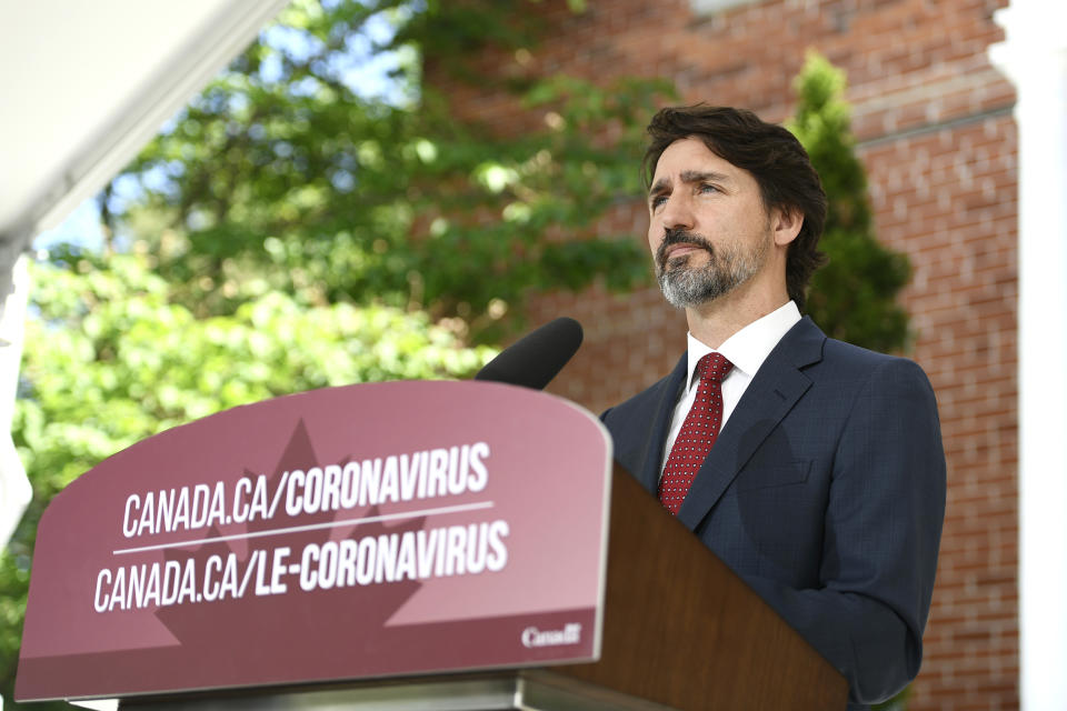 Canadian Prime Minister Justin Trudeau speaks during a news conference on the COVID-19 pandemic outside his residence at Rideau Cottage in Ottawa, Ontario, on Thursday, June 18, 2020. (Justin Tang/The Canadian Press via AP)