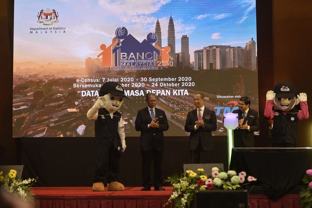 Datuk Seri Mustapa Mohamed (second from left) is pictured at the launch of the Malaysian Population and Housing Census 2020 at the Putrajaya International Convention Centre July 7, 2020. — Picture by Miera Zulyana