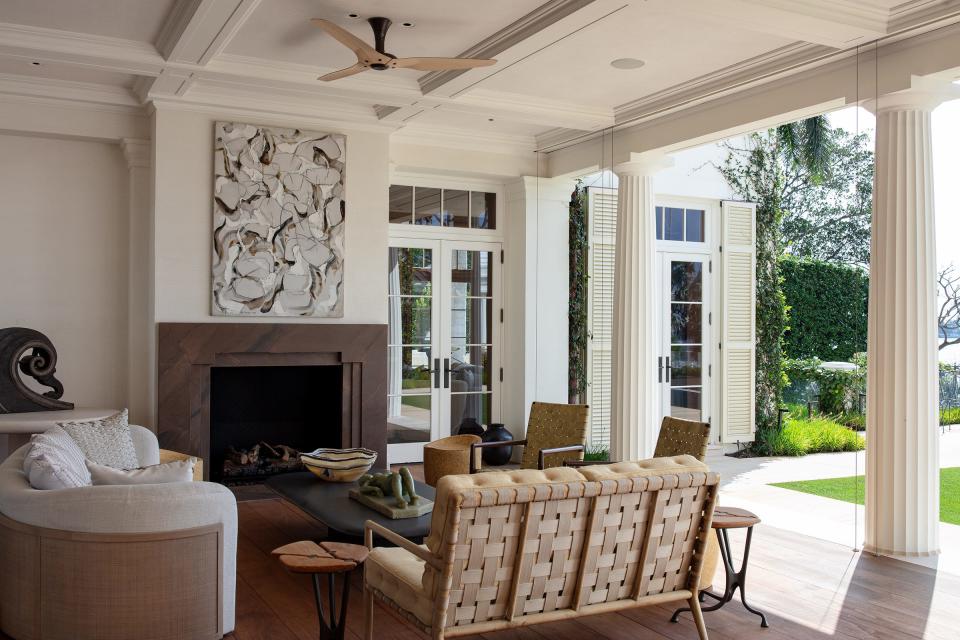 Central to the design of the house is the expansive outdoor living room — essentially a main-floor loggia — overlooking the Intracoastal Waterway.