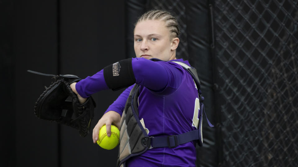 FILE - James Madison catcher Lauren Bernett throws during an NCAA college softball game on May 28, 2021, in Columbia, Mo. Five college athletes, including Meyer, took their own lives in the spring, sparking concerns that schools were not doing enough for some of their higher-profile students. (AP Photo/Colin E. Braley, File)