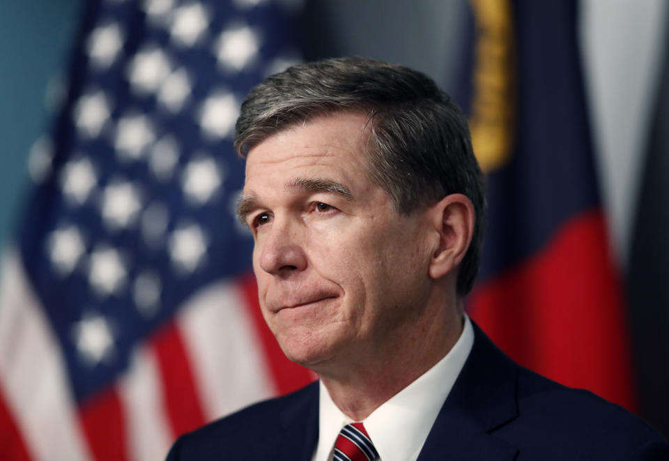 North Carolina Gov. Roy Cooper listens to a question during a briefing on the coronavirus pandemic at the Emergency Operations Center in Raleigh, N.C., Tuesday, May 26, 2020. (Ethan Hyman/The News & Observer via AP)