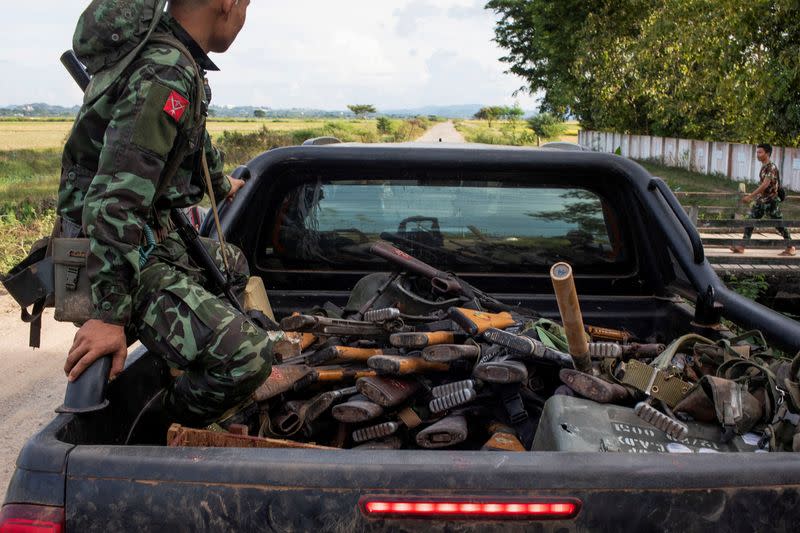 FILE PHOTO: A member of Karenni Army rides a truck with seized weapons during a battle in Loikaw in Kayah State