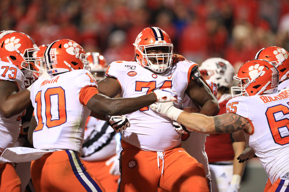 RALEIGH, NORTH CAROLINA - NOVEMBER 09: John Simpson #74 of the Clemson Tigers reacts after running for a touchdown against the North Carolina State Wolfpack during their game at Carter-Finley Stadium on November 09, 2019 in Raleigh, North Carolina. (Photo by Streeter Lecka/Getty Images)