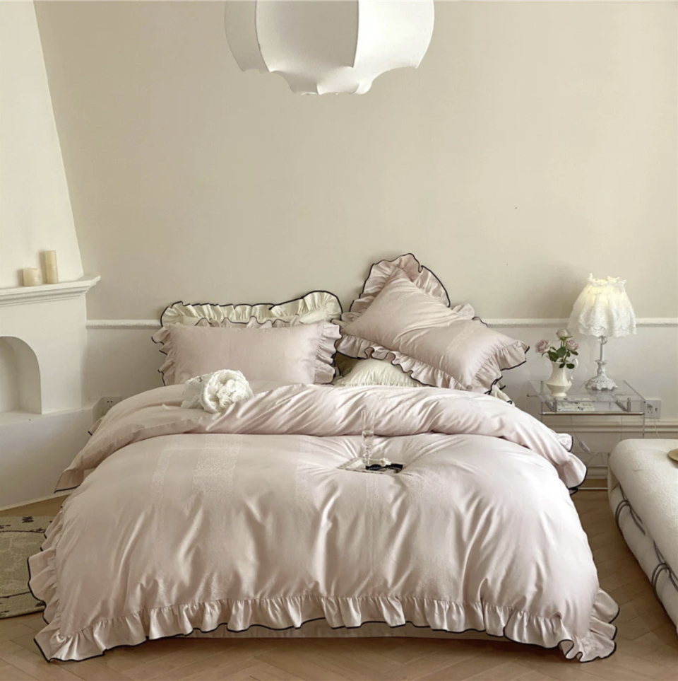 <p><a href="https://everlastingfabric.com/products/silky-ruffle-bedding-set-rust-pink" rel="nofollow noopener" target="_blank" data-ylk="slk:Shop Now;elm:context_link;itc:0;sec:content-canvas" class="link ">Shop Now</a></p><p>Silky Ruffle Bedding Set </p><p>everlastingfabric.com</p><p>$219.00</p>