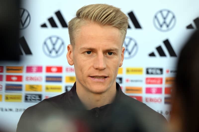 Germany's Chris Führich answers journalists' questions. High-flying VfB Stuttgart could reportedly be represented with four players when Germany coach Julian Nagelsmann nominates his squad for upcoming friendlies against France and the Netherlands on Thursday. Federico Gambarini/dpa