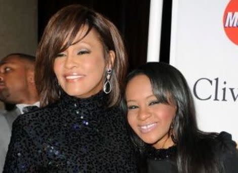 Whitney Houston, dead at the age of 48, with daughter Bobbi Kristina Brown.