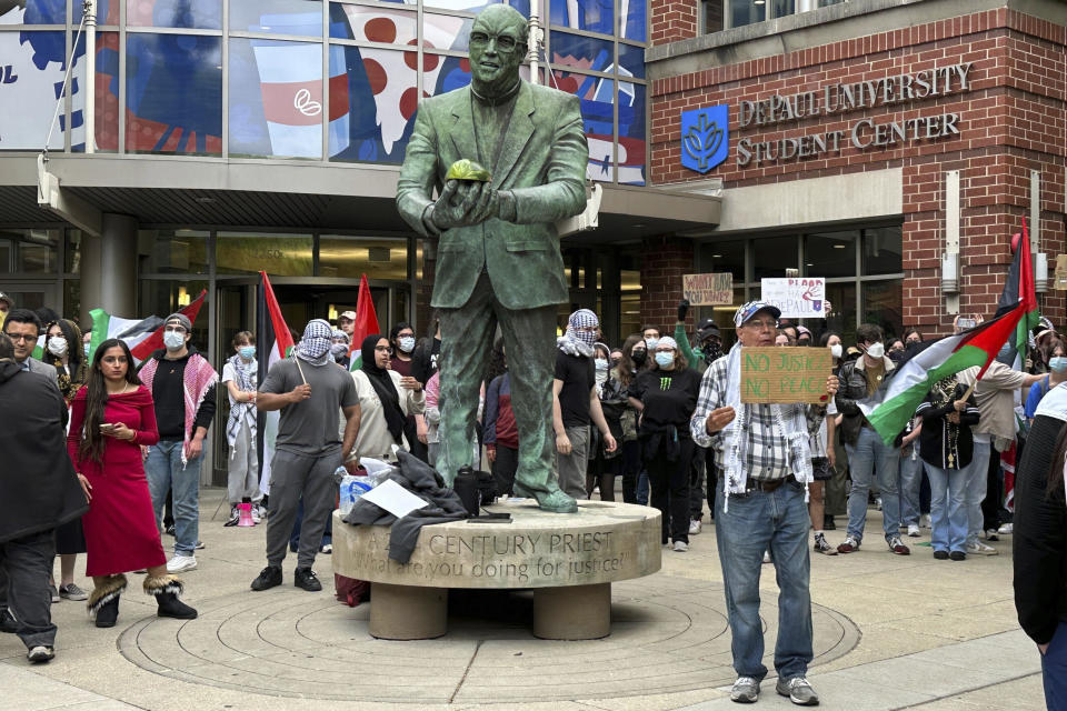 Antiwar protesters rallied at DePaul University in Chicago, Thursday evening, May 16, 2024, after an encampment at the campus quad had been taken down by university police early in the morning. (AP Photo/Melissa Perez Winder)