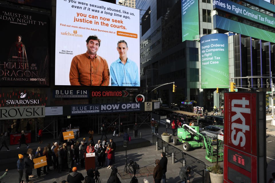 A Safe Horizon PSA about the Adult Survivors Act plays in Times Square during a press conference on the new law, Friday, Nov. 18, 2022, in New York. Sexual assault victims in New York will get a one-time opportunity to sue their abusers starting Thursday under a new law expected to bring a wave of litigation against prison guards, middle managers, doctors and a few prominent figures including former President Donald Trump. (AP Photo/Julia Nikhinson)