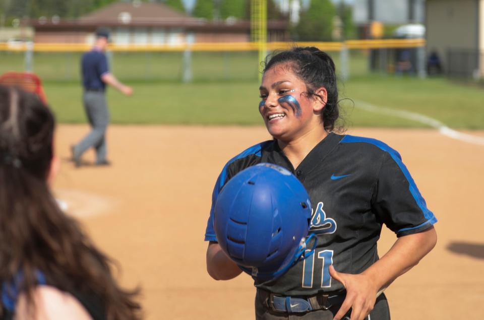 McNary's Ali Martinez celebrates a run against North Medford during the 6A softball playoff game at McNary High School in Keizer, Ore. on Wednesday, May 25, 2022.