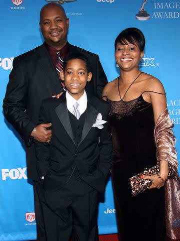 <p>Frederick M. Brown/Getty</p> Tyler James Williams and parents arrive at the 37th Annual NAACP Image Awards on February 25, 2006 in Los Angeles, California.