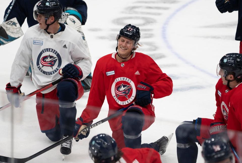 Sep 29, 2023; Columbus, Ohio, United States; Columbus Blue Jackets defenseman Adam Boqvist (27) laughs with teammates during CBJ Training Camp at Nationwide Arena.