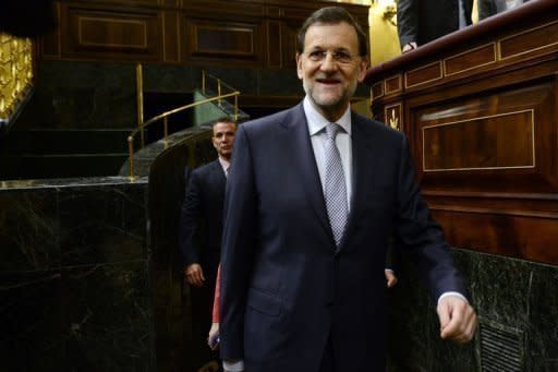 Spain's Prime Minister Mariano Rajoy arrives for a parliament session in Madrid. Rajoy announced Wednesday a 65-billion-euro austerity package to avert financial collapse as protesters against mining cuts clashed with police