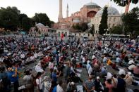 People gather in front of the Hagia Sophia or Ayasofya, after a court decision that paves the way for it to be converted from a museum back into a mosque, in Istanbul