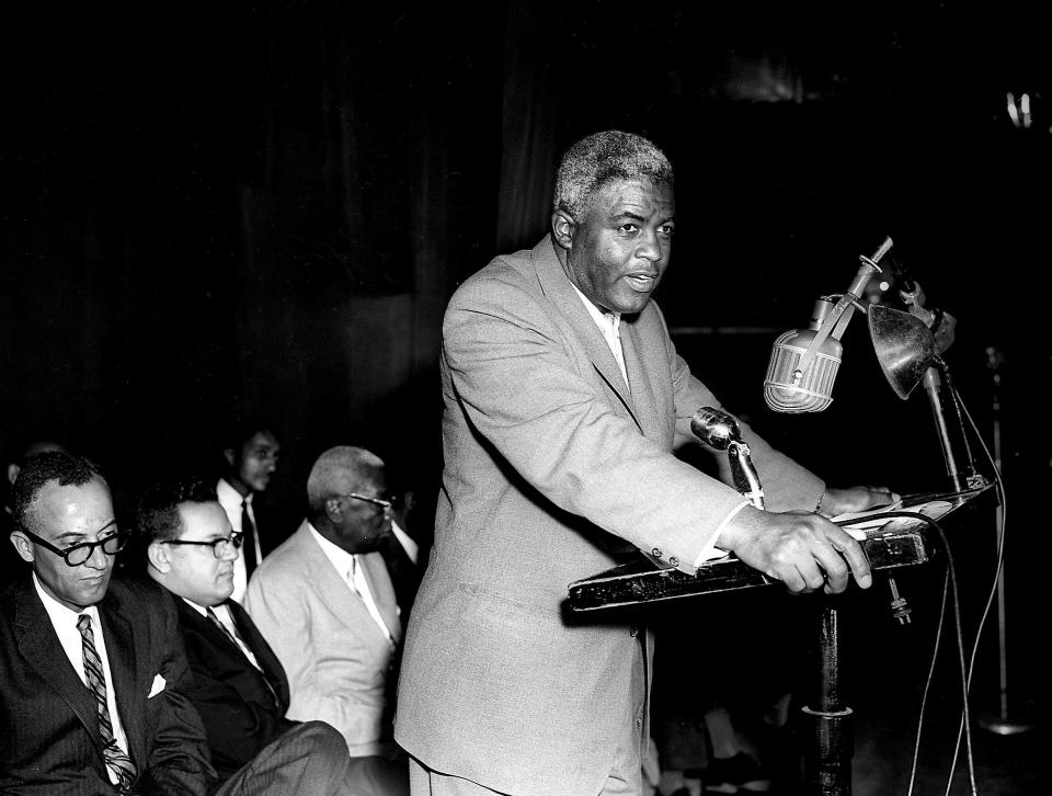 Jackie Robinson, who crashed the racial barriers and became the first black baseball major leaguer, makes a speech on the stage of the Ryman Auditorium April 15, 1962. Robinson, who was elected to the Hall of Fame in January, told about his experience in baseball. He also told the rally that the black's vote is his greatest weapon for civil rights.