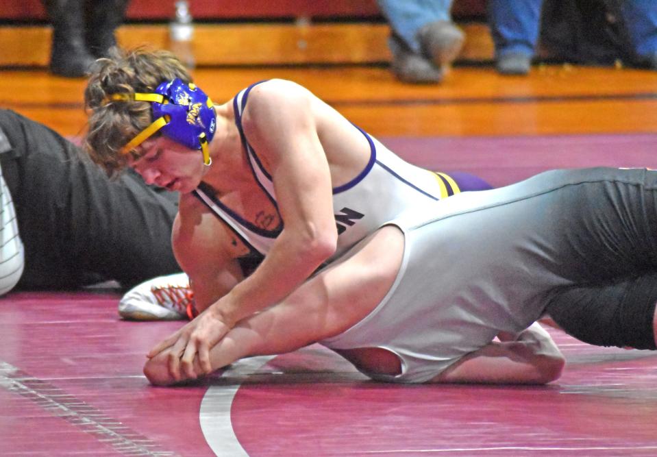 Bronson's Perry Lake posts the arm of his opponent on his way to a pin fall win versus Homer Wednesday night