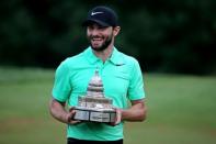 Jul 2, 2017; Potomac, MD, USA; Kyle Stanley celebrates with the trophy after winning the Quicken Loans National golf tournament at TPC Potomac at Avenel Farm. Mandatory Credit: Peter Casey-USA TODAY Sports