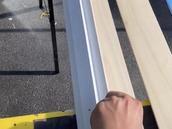 Twomey works on his LED ceiling.