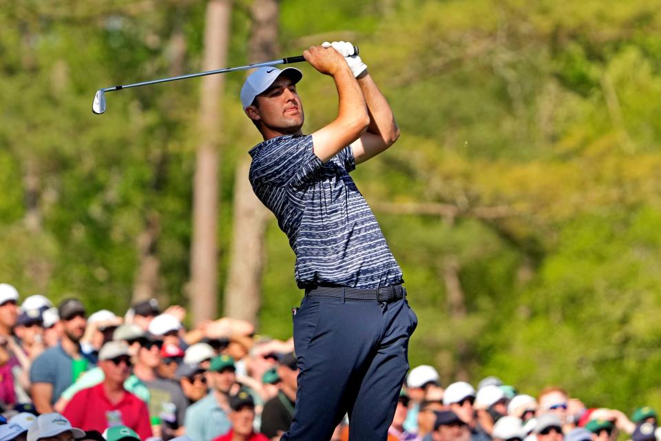 Scottie Scheffler watches his shot from the 12th tee during the final round of the Masters.