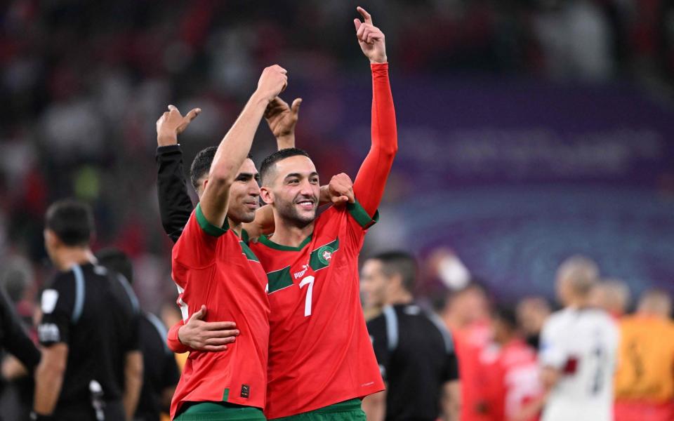 Morocco's defender #02 Achraf Hakimi (L) and Morocco's midfielder #07 Hakim Ziyech celebrate winning the Qatar 2022 World Cup quarter-final football match between Morocco and Portugal at the Al-Thumama Stadium - Kirill Kudryavtsev/Getty Images