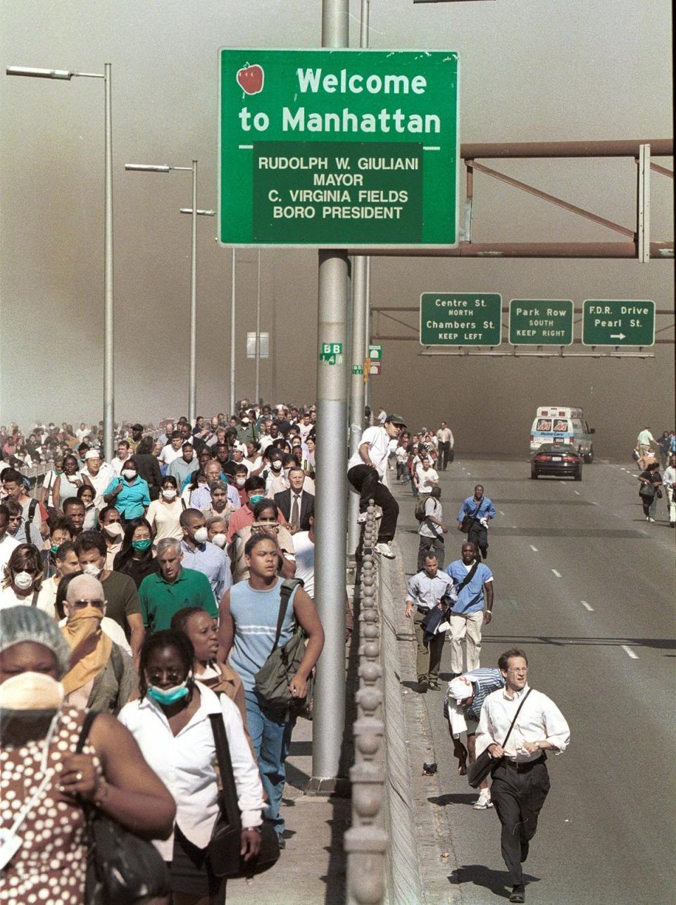 People flee Lower Manhattan across the Brooklyn Bridge (AP)