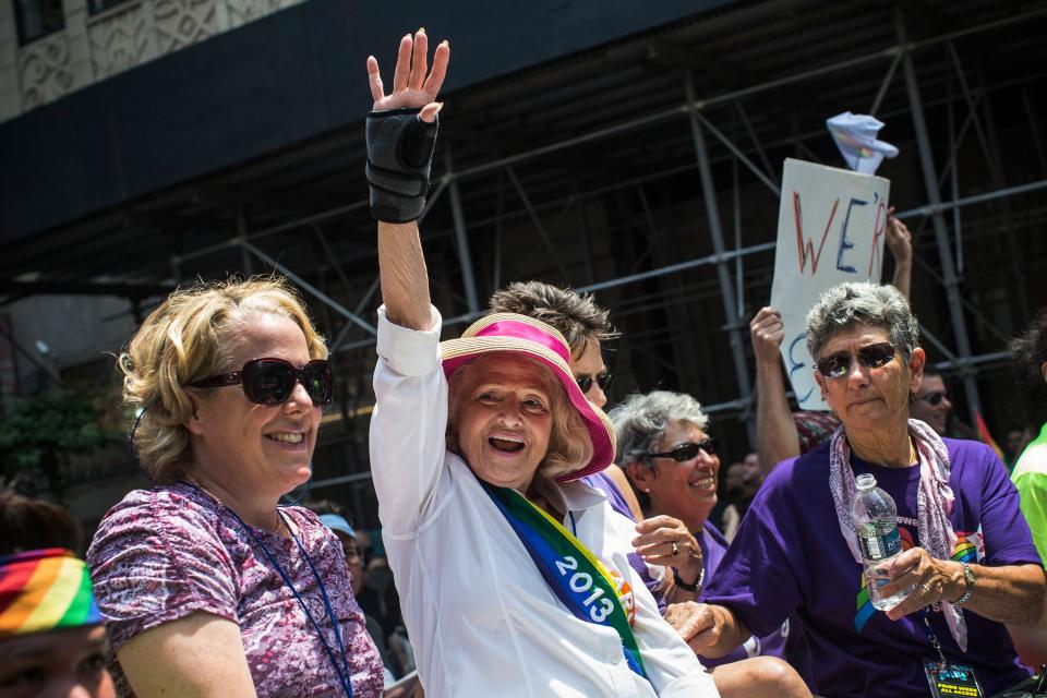 Edie Windsor, who successfully sued the United States government over the constitutionality of the Defense of Marriage Act (DOMA), waves to revelers while riding in the New York Gay Pride Parade on June 30, 2013 in New York City.