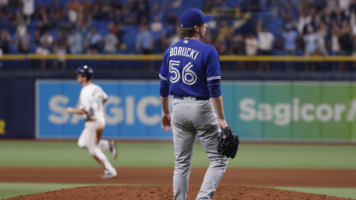 Ryan Borucki (56) looks on as he gives up a home run to Rays third baseman Joey Wendle (18) (USA TODAY Sports)