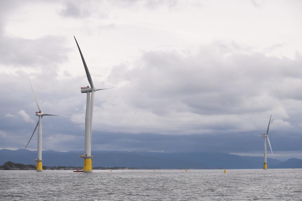 Fully assembled wind turbines undergoing tests and adjustments before being towed out to the site of the Hywind Tampen wind farm, about 85 miles off the Norwegian coast.