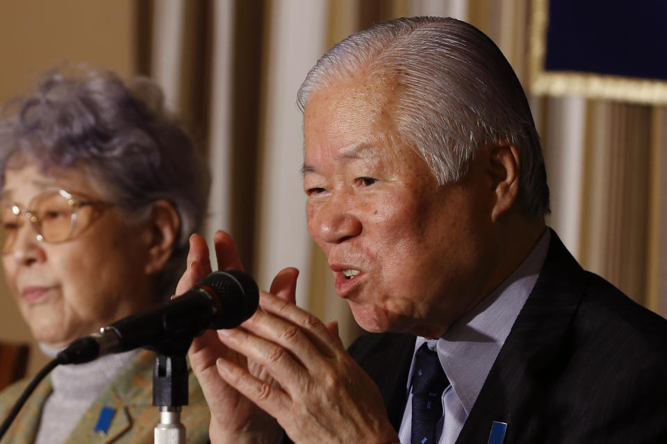 FILE - In this March 24, 2014, file photo, Shigeru Yokota, the father of Megumi Yokota who was abducted by North Korea in 1977, speaks as his wife Sakie listens during a news conference at the Foreign Correspondents' Club of Japan in Tokyo. Shigeru Yokota died of natural causes before he was able to meet his daughter again, his group said Friday, June 5, 2020. He was 87. (AP Photo/Shizuo Kambayashi, File)