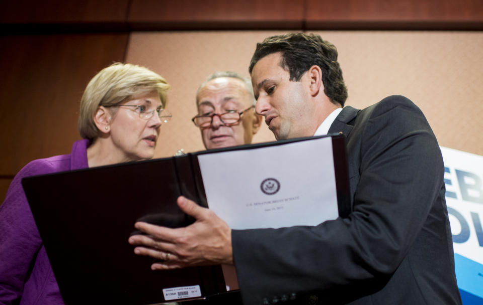 UNITED STATES - JUNE 10: From left, Sen. Elizabeth Warren, D-Mass., Sen. Chuck Schumer, D-N.Y., and Sen. Brian Schatz, D-Hawaii, participate in the press conference in the Capitol to call for the elimination of student loan debt at public higher education institutions on Wednesday, June 10, 2015. (Photo By Bill Clark/CQ Roll Call)