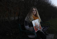 Jo Goodman holds a portrait of her late father Stuart as she poses for a photo in London, Friday, Jan. 22, 2021. Jo's father Stuart died of COVID-19, in April 2020. A couple of months after her father died, Goodman, 32, co-founded the COVID-19 Bereaved Families for Justice group to pressure the government to back a public inquiry into how the pandemic was handled last spring. (AP Photo/Alastair Grant)