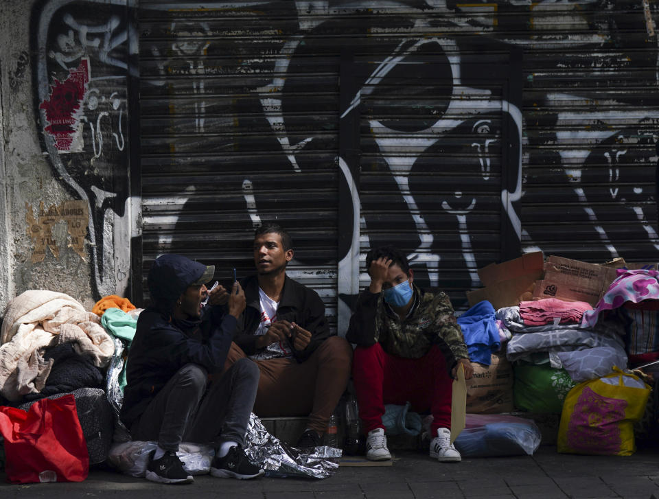 Venezuelan migrants wait for assistance outside of the Mexican Commission for Refugee Aid in Mexico City, Thursday, Oct. 20, 2022. This group of migrants interrupted their trek in Mexico City after the U.S. announced that Venezuelans who walk or swim across the border will be immediately returned to Mexico without the right to seek asylum. (AP Photo/Fernando Llano)