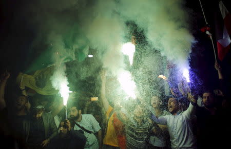 Pro-Islamists demonstrators light flares during a protest against an Egyptian court's decision to sentence deposed President Mohamed Mursi to death, in front of the Egyptian Consulate in Istanbul, Turkey, early June 17, 2015. REUTERS/Murad Sezer