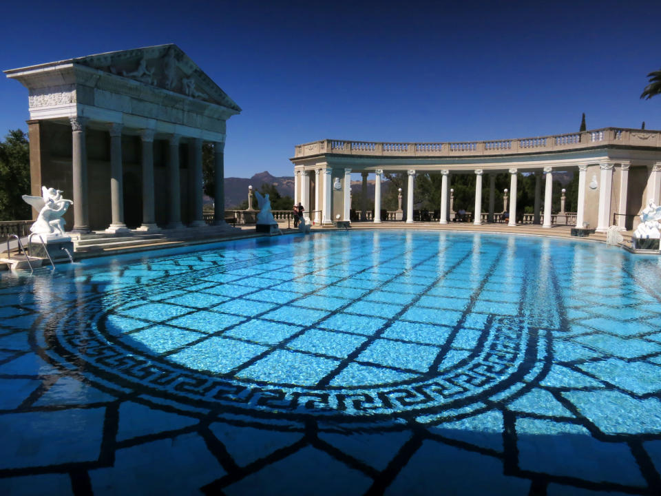 This Aug. 30, 2013 photo shows ancient Roman columns, dating from the first to fourth centuries, surrounding the Hearst Castle's Neptune Pool, on newspaper publisher William Randolph Hearst's 165-room estate in San Simeon, Calif. (AP Photo/Jim MacMillan)