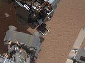 This image from the right Mast Camera (Mastcam) of NASA's Mars rover Curiosity shows a scoop full of sand and dust lifted by the rover's first use of the scoop on its robotic arm. In the foreground, near the bottom of the image, a bright object is visible on the ground. The object might be a piece of rover hardware. (NASA)