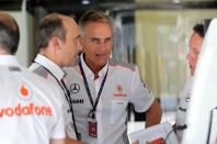 McLaren's CEO Martin Whitmarsh (centre) during qualifying day for the 2013 Italian Grand Prix at the Autodromo di Monza in Monza, Italy.