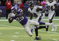 <p>Minnesota Vikings running back Latavius Murray (25) dives to the end zone ahead of Baltimore Ravens outside linebacker Patrick Onwuasor (48) during a 29-yard touchdown run in the second half of an NFL football game, Sunday, Oct. 22, 2017, in Minneapolis. (AP Photo/Jim Mone) </p>