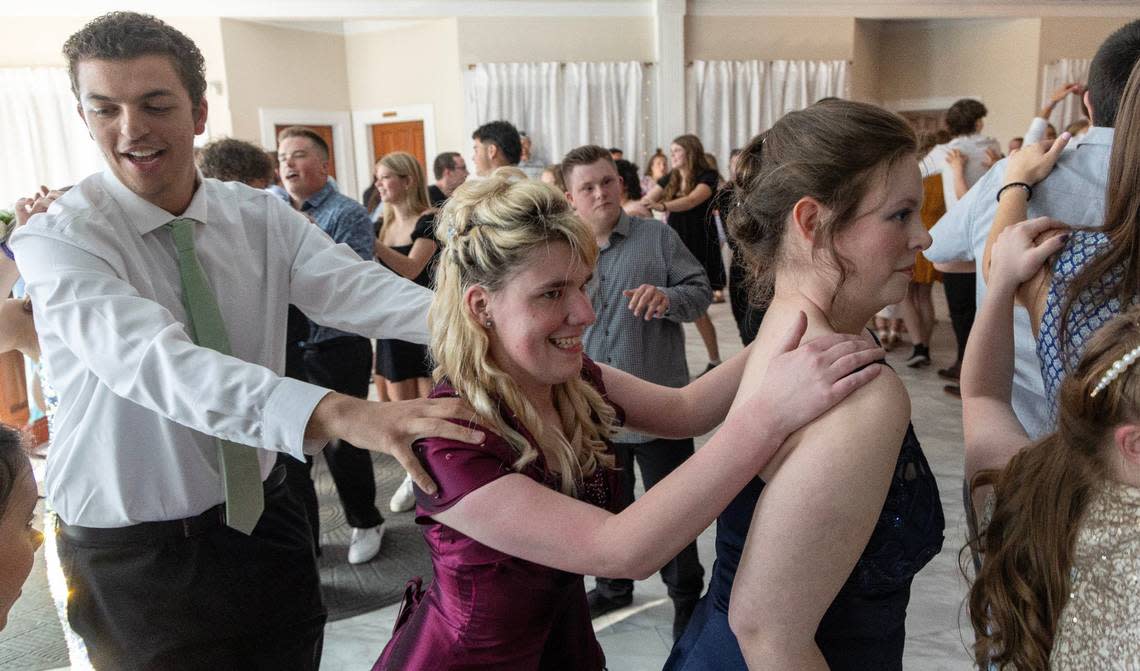 Students dance in a train formation during VIP Prom on Saturday at Potomac Manor Event Center.
