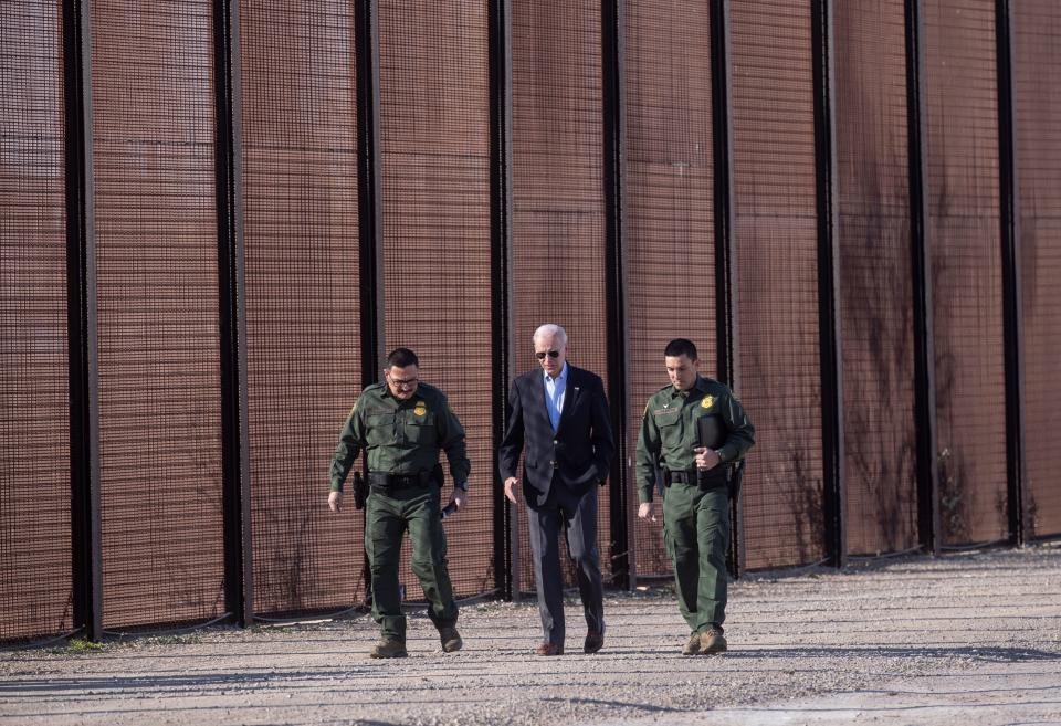 President Joe Biden walks with Customs and Border Protection officers during his visit to the border wall in El Paso, Texas on Jan. 9, 2023. 