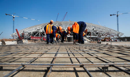 Construction workers are seen at Samara Arena stadium under construction in Samara, Russia August 23, 2017. REUTERS/Maxim Shemetov