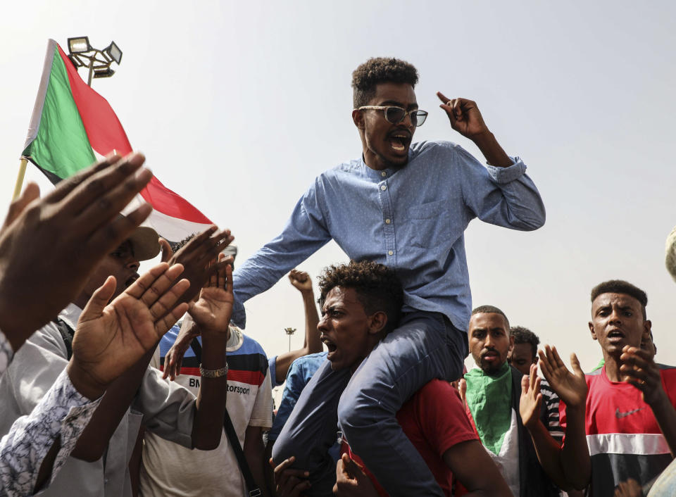 People take part in a protest condemning a deadly crackdown last month in Khartoum, Sudan, Thursday, July 18, 2019. Thousands of Sudanese have joined protests as tensions remain high despite recent progress toward a power-sharing deal with the ruling military council. (AP Photo/Mahmoud Hjaj)