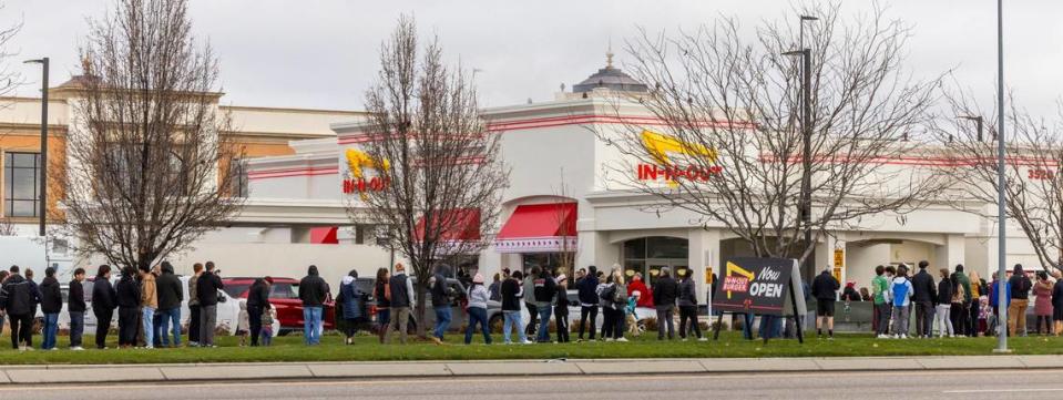 A line grows longer as the noon hour approaches Tuesday at the In-N-Out opening in Meridian.