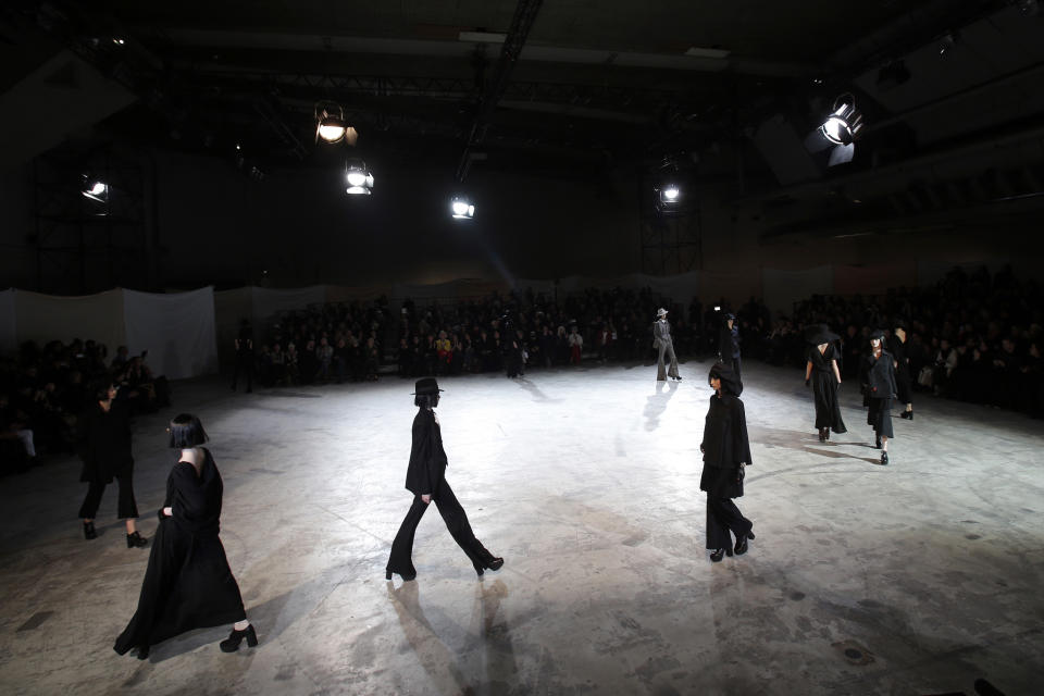 Models wear creations by Japanese fashion designer Yohji Yamamoto for his Fall/Winter 2013-2014 ready to wear collection, in Paris, Friday, March 1, 2013. (AP Photo/Christophe Ena)