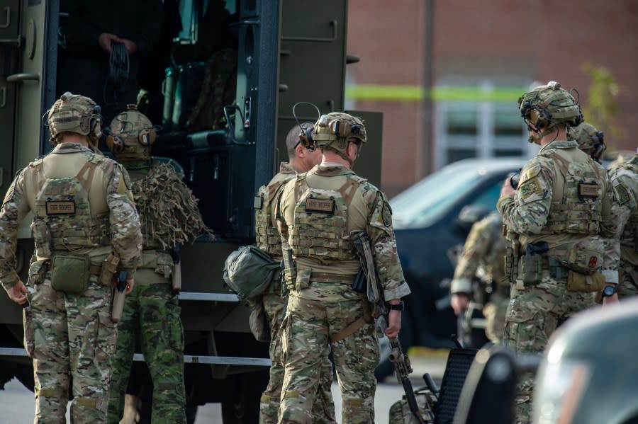 Law enforcement officers gather outside Lewiston High School, Maine on October 26, 2023. A massive manhunt was under way on October 26 for a gunman who a local official said killed at least 22 people and wounded dozens more in mass shootings in the US state of Maine, the deadliest such incident this year. (Photo by Joseph Prezioso / AFP) (Photo by JOSEPH PREZIOSO/AFP via Getty Images)